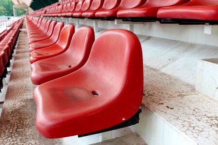 Red chair for watching the sport on the outdoor stadium