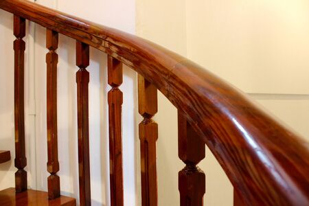 Wooden spiral staircase for walking up to the top of castle in Thai temple at Bangkok, Thailandの写真素材