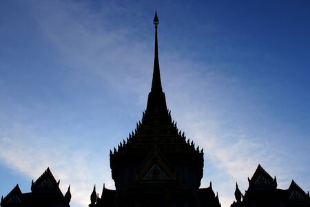 The silhouette of a Thai temple with a background of blue sky, Bangkok, Thailand