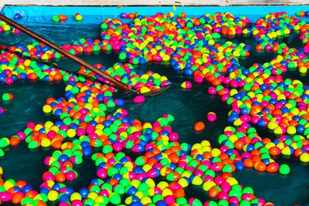 Colorful plastic lucky eggs in the pond, Bangkok, Thailand の写真素材