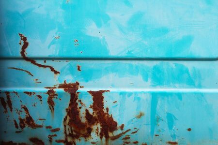 Weathered and rusty old car body as a background