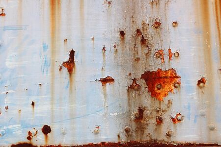Weathered and rusty old car body as a background