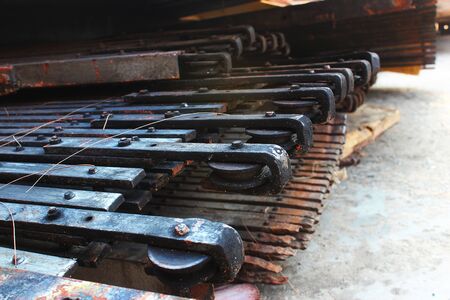 The damaged and rusty steel doors are placed in front of the steel door repair shop
