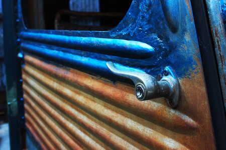 An antique door handle of the rusty old carの写真素材