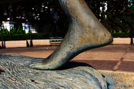 The left foot of a woman statue in the parkの写真素材