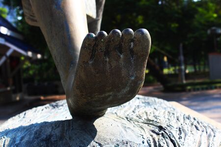 The right foot of a woman statue in the parkの写真素材