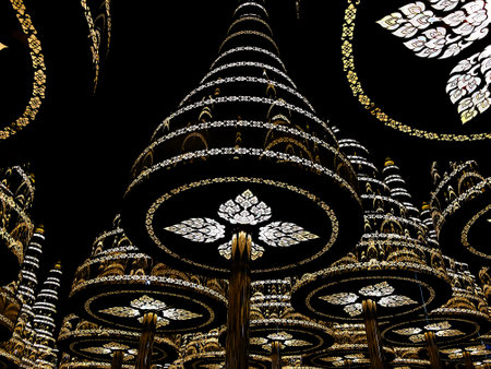 Night scene of beautiful artificial pine trees decorated with Thai pattern lights