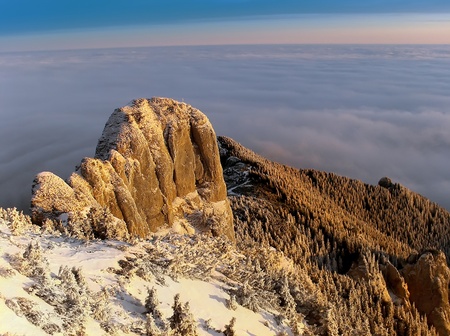 stone on mountain with alpine sea at sunriseの写真素材