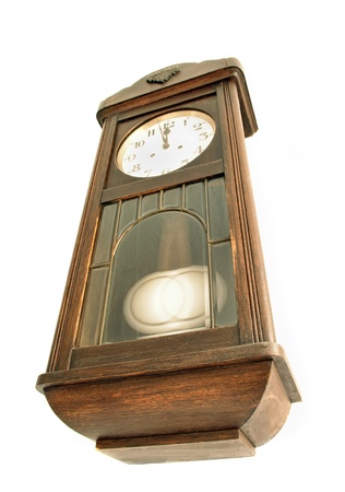 Old-fashioned wooden clock on the wallの写真素材