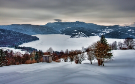 traditional winter village landscape in Romania Carpathiansの写真素材