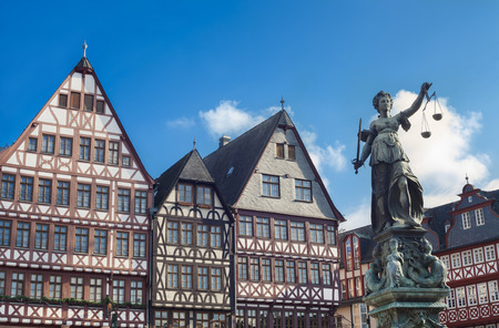 old buildings and statue of Lady Justice statue in Frankfurtのeditorial素材