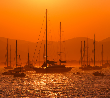 sunset and boats on the seaの写真素材