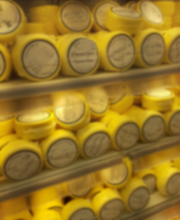 blurry image of cheese productsの写真素材