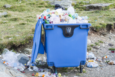 recycle bin full of garbageの写真素材