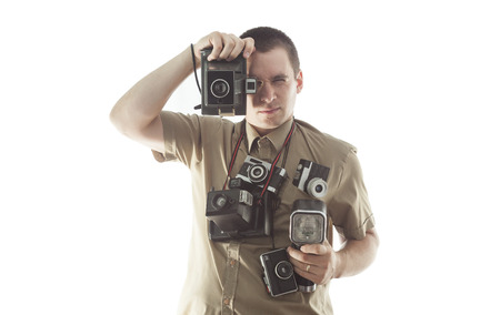 man taking photo in studio with vintage camera equipment