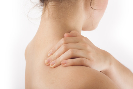 young woman having neck pain conceptの写真素材