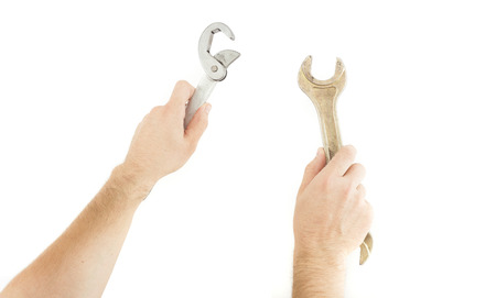 hands holding wrench tool isolated on white
