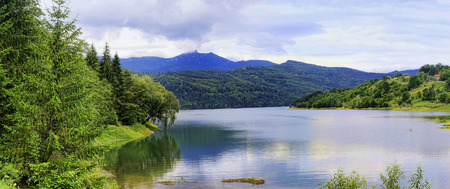 landscape with Bicaz lake and Ceahlau mountain, Romaniaの写真素材