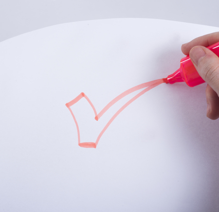 hand drawin red ok sign with marker on paperの写真素材