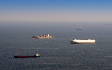 many cargo ships waiting for port entrance. industrial photoの写真素材