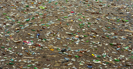 lake pollution with plastic bags and toxic waste in the waterの写真素材