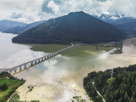 flooded water. Bicaz lake and viaduct, Romaniaの写真素材