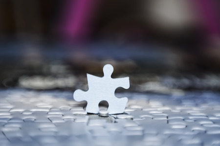 one puzzle piece stand out from the crowd. business conceptの写真素材