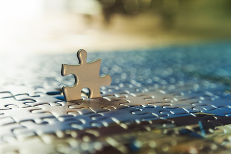 one puzzle piece stand out from the crowdの写真素材