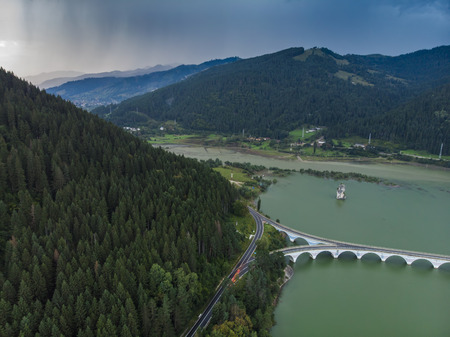 storm coming over the lake. aerial view. Romaniaの写真素材