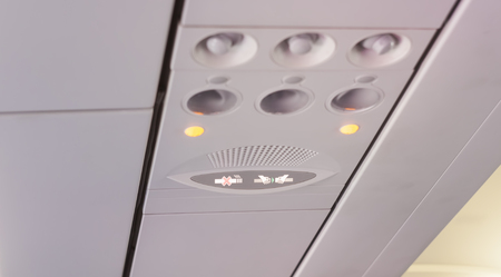 no smoking and seatbelt sign inside airplaneの写真素材