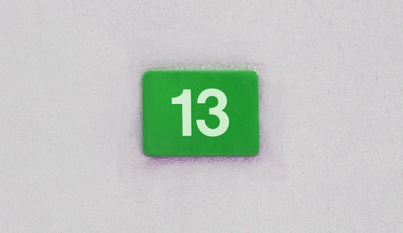 number 13 sign on the wall, bad luck conceptの写真素材