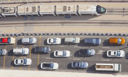 DUBAI, UAE - SEPTEMBER 27 2018: traffic with cars and tram in Dubai Marina. Aerial view