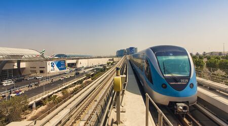DUBAI, UAE - SEPTEMBER 25 2018: modern metro station at Dubai International airport city view