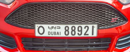 DUBAI, UAE - SEPTEMBER 25 2018: front of modern sports car with Dubai number plate