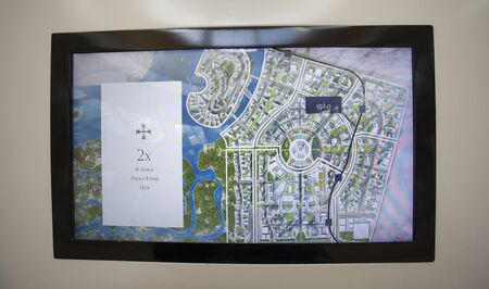 DUBAI, UAE - SEPTEMBER 28 2018: screen with map of Dubai Creek Tower model in Dubai Mall, it will be...