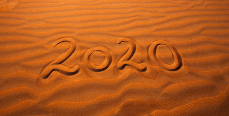 2020 year written in the desert sandの写真素材