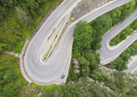 curved road with cars and beautiful forest landscape. Bicaz gorges, Romania. Aerial view from drone
