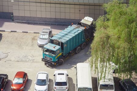 DUBAI, UAE - SEPTEMBER 25 2018: garbage truck for recycle in the city