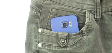 modern smartphone in jeans pocketの写真素材