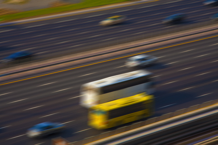 abstract blur of cars in motion. highway traffic scene in city