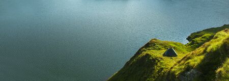 tent near the lake. mountain landscape