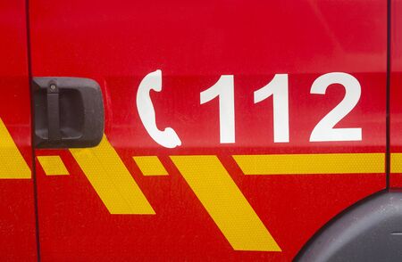 112 call emergency number on fire truckの写真素材