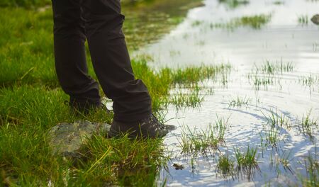 man with waterproof mountain boot in water