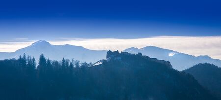 Romania in winter. Rasnov fortress and Bucegi mountainのeditorial素材