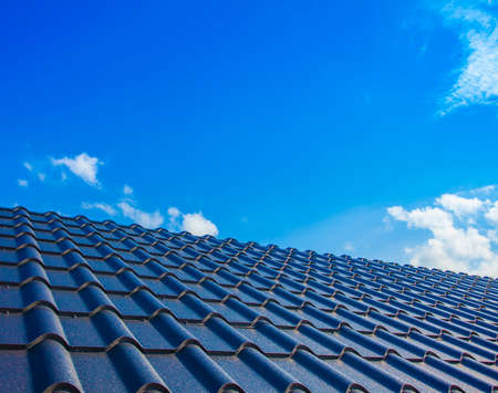 new house roof and clear blue skyの写真素材