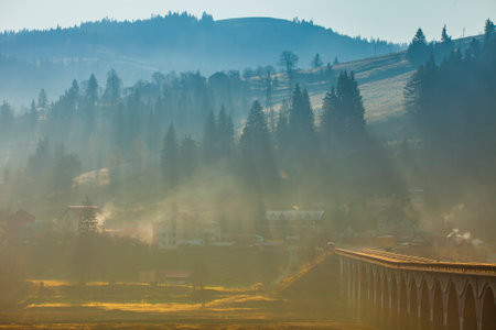 morning landscape in the village. mist and forest scene, Romaniaの写真素材