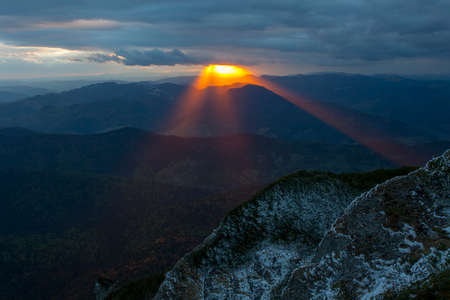 Sunset rays in the mountain landscape. Ceahlau, Romaniaの写真素材