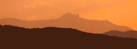 mountain sunset landscape. silhouette of Ceahlau, Romania Carpathians.