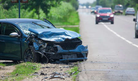 damaged car in accident on the roadの写真素材