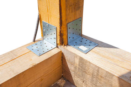 Steel corner mounting plate for joining wooden structures on white backgroundの写真素材